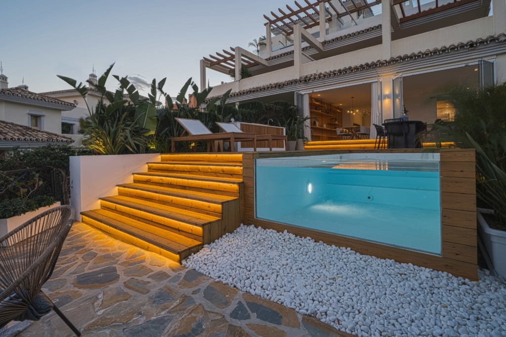 Night photo of infinity pool and stairs with lighting