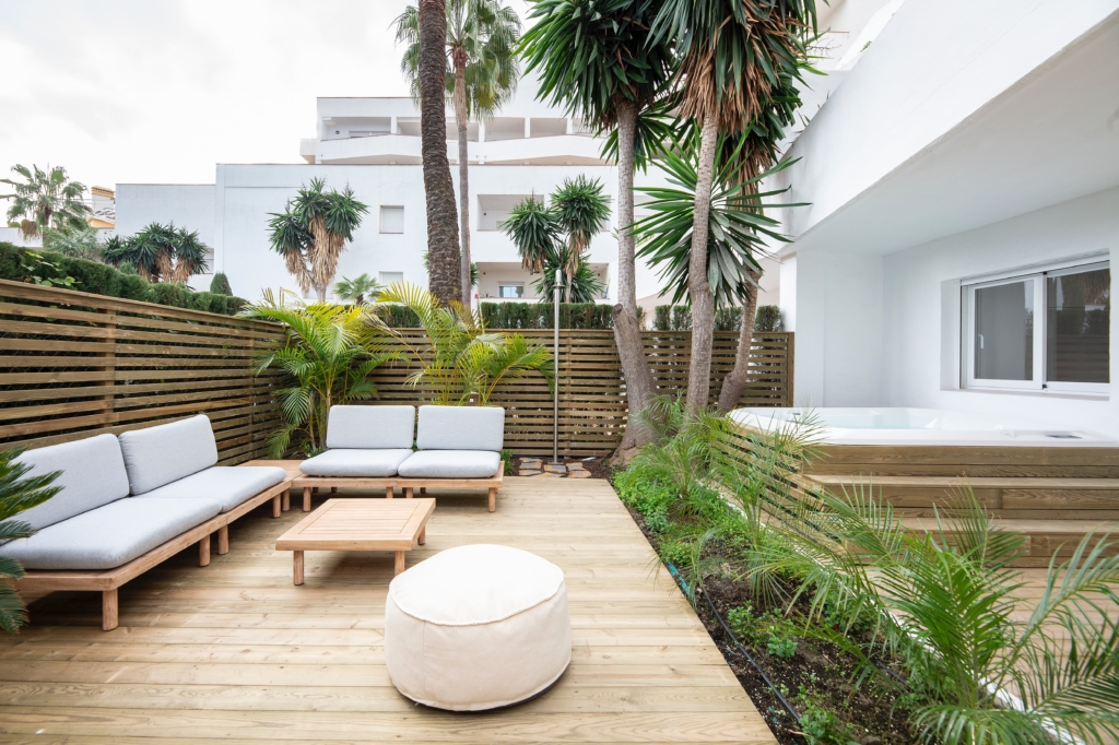 Tropical terrace with gray lounge set