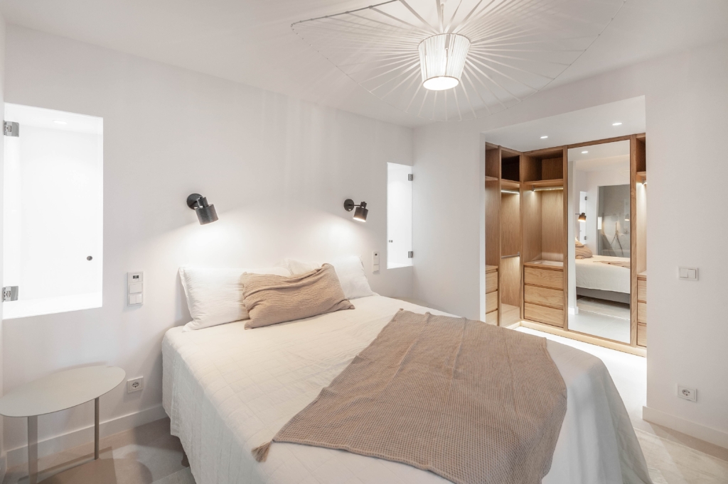 Modern master bedroom with custom wooden closet
